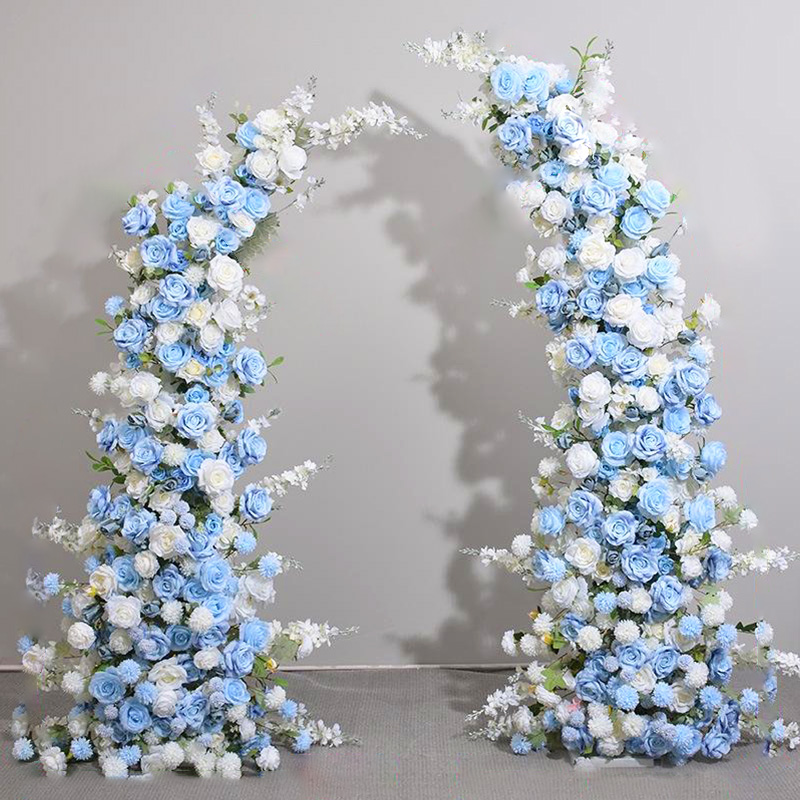 Romantic floral decoration in the wedding ceremony area with blue and white artificial flower arches