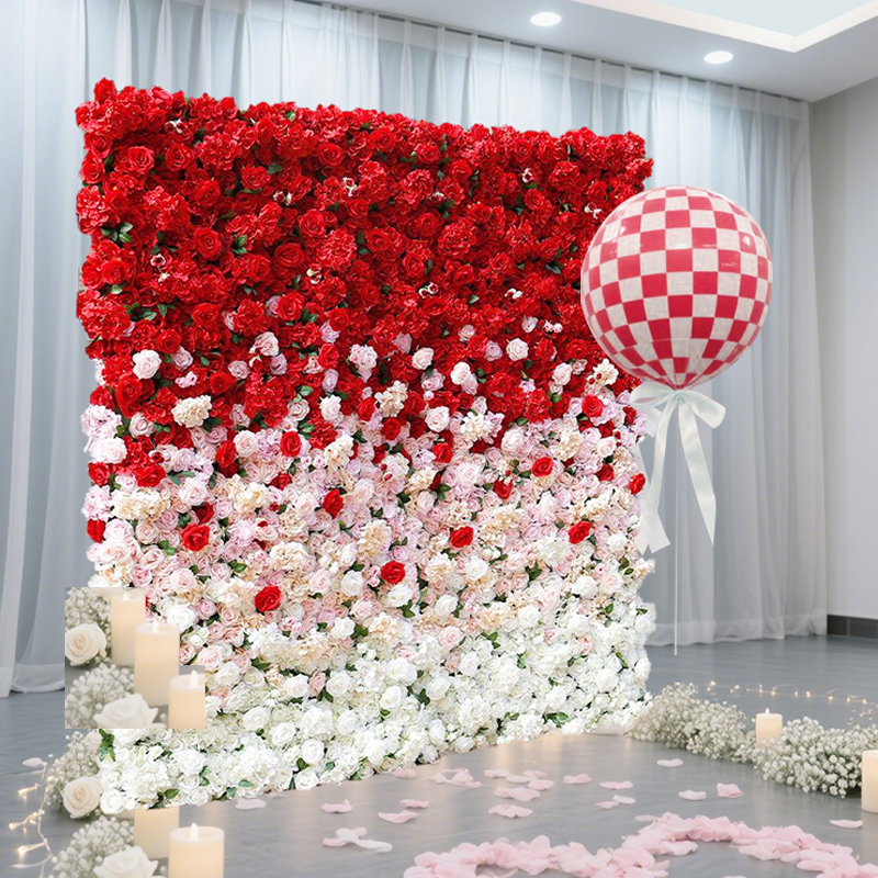 The creative red and white gradient flower wall adds a touch of beauty to the event